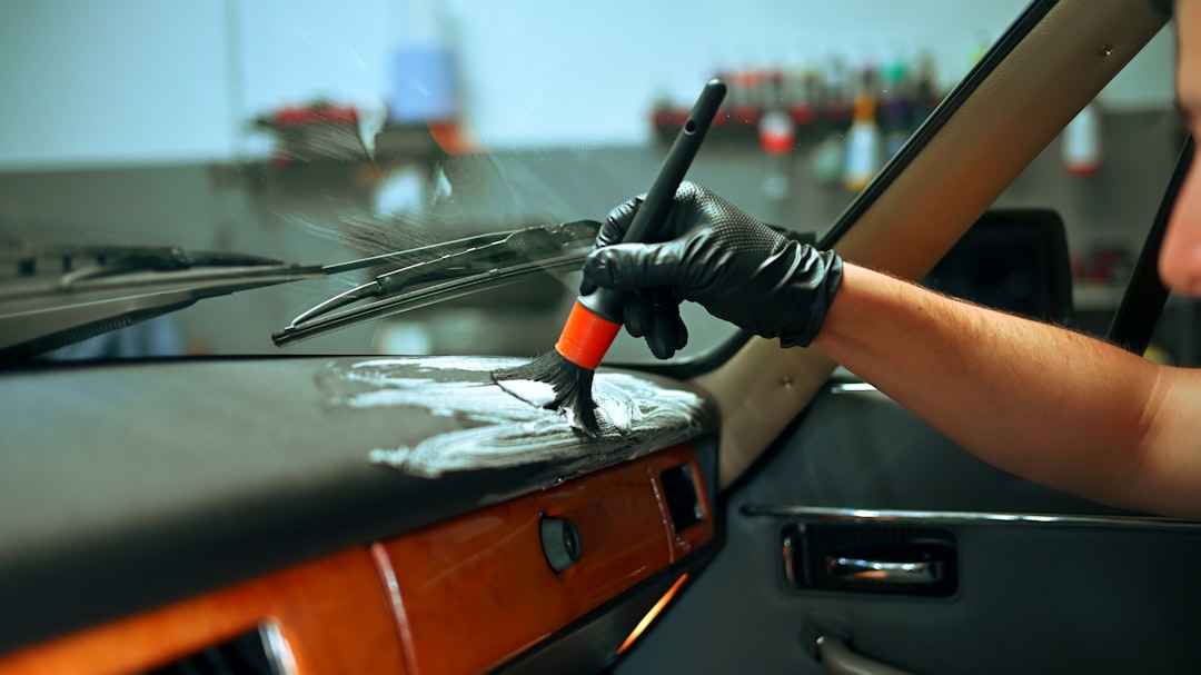 detailer-cleaning-the-dashboard-of-a-classic-car-5smpnmcjwcu